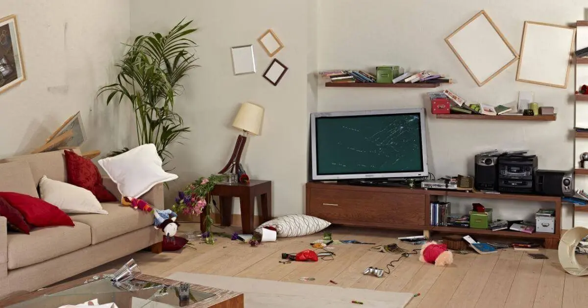 Damaged Rental Property - Tired Landlord Damaged rental property with broken furniture, scattered belongings, and a cracked TV screen—highlighting the challenges landlords face with difficult tenants.
