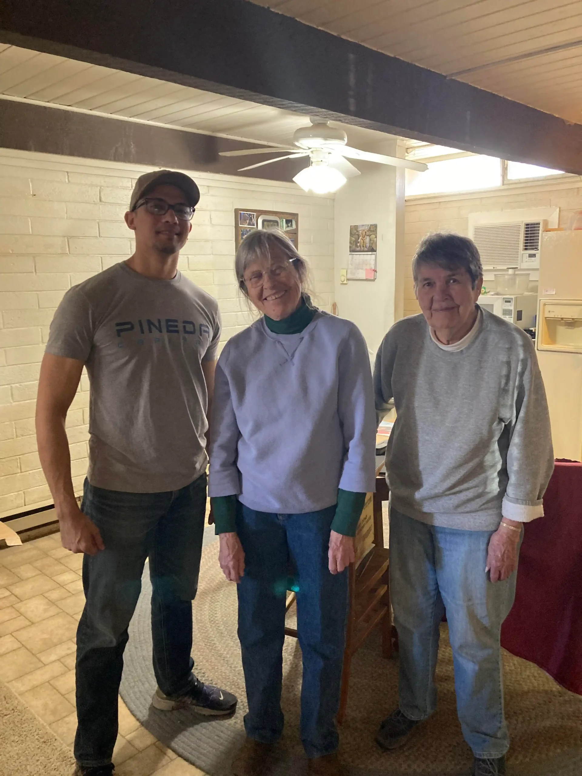 Rich from 702 Cash Buyers standing with two sisters who inherited a home from their parents and chose to sell it after struggling with upkeep—highlighting how 702 Cash Buyers helps families navigate emotional and practical challenges when selling inherited property.