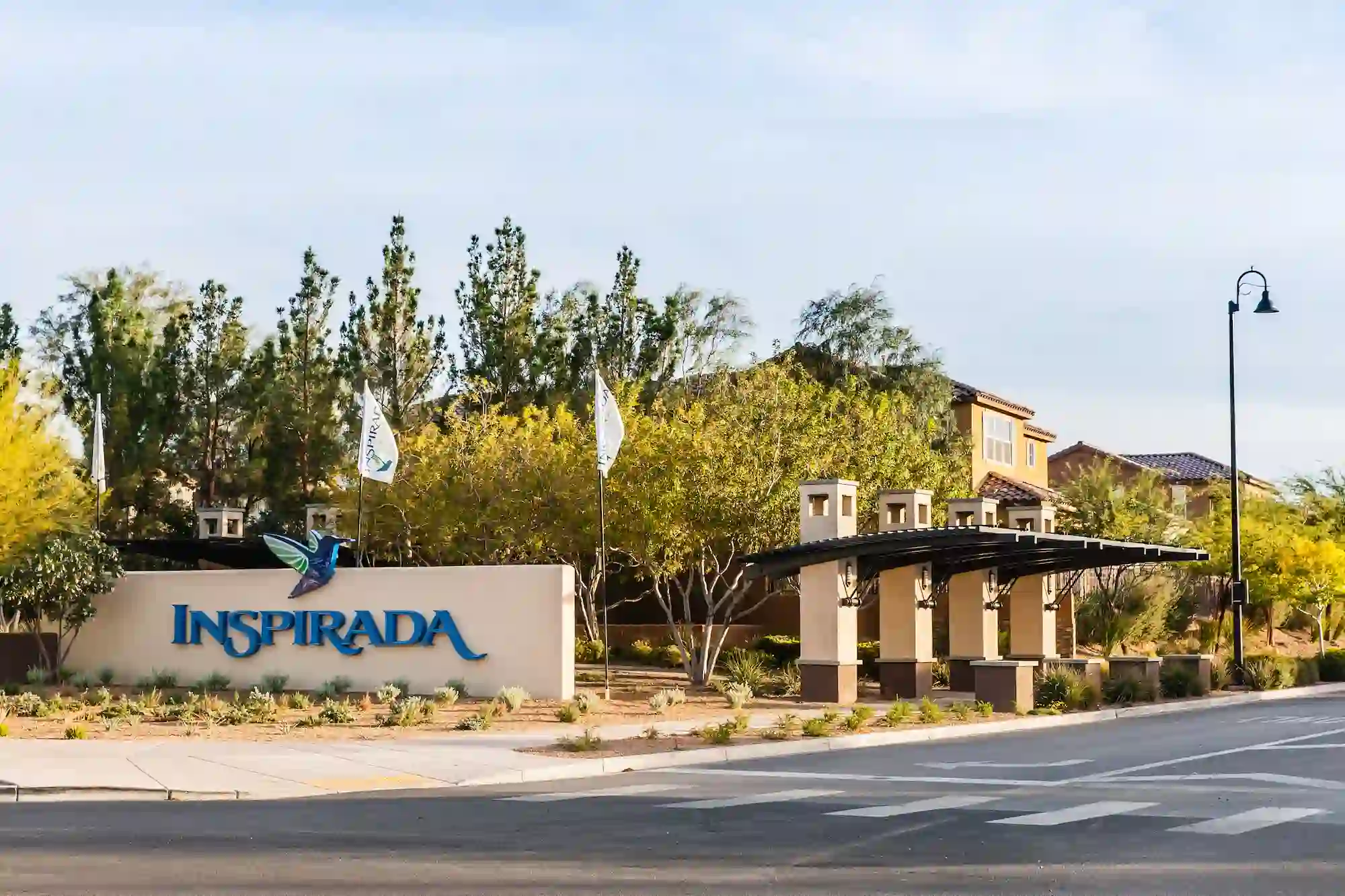 Inspirada Henderson Neighborhood Entrance sign to Inspirada, a popular master-planned community in Henderson, Nevada, featuring tree-lined streets, modern homes, and family-friendly amenities—one of the best neighborhoods in the Henderson area.