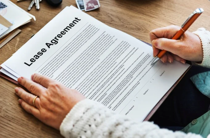 home seller signing lease option agreement to sell house with flexible terms